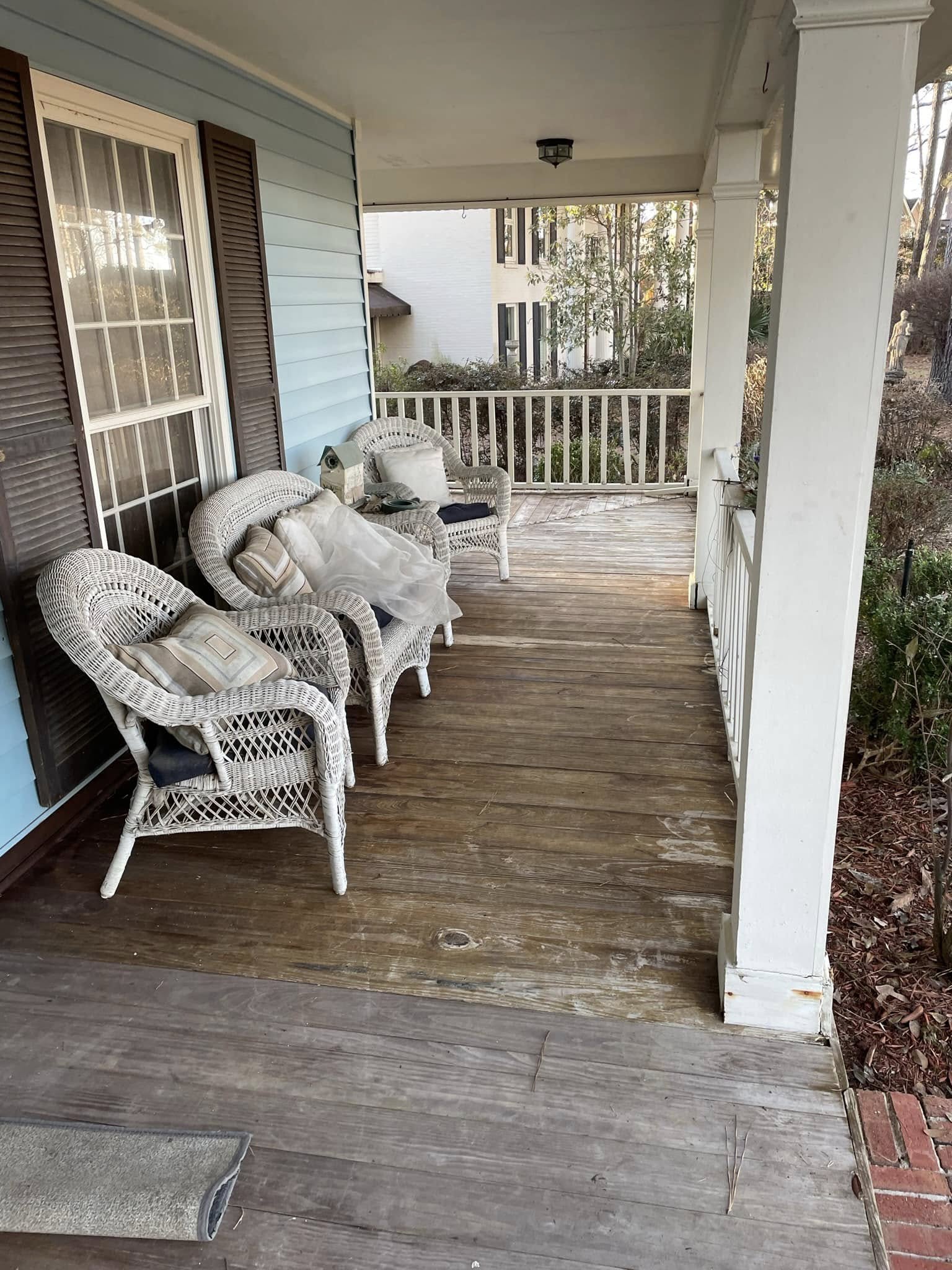 Same wood porch — refreshed deck boards after pressure washing